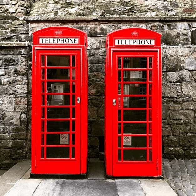 two red telephone boxes min